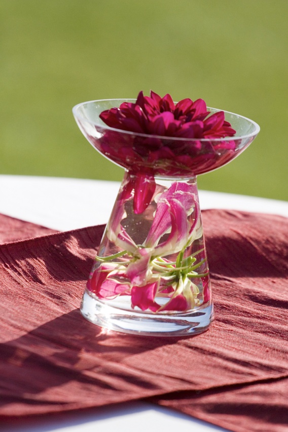 Small Floral Centerpiece
Photography: Ventana Photography
Read More:
http://www.insideweddings.com/weddings/black-and-red-wedding-on-golf-course-at-the-lodge-at-torrey-pines/122/ Glass vase with lilies under water and dahlia in bowl on top