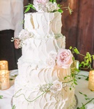 Classic White Cake with Vines %26 Florals
Photography: Bottega53
Read More:
http://www.insideweddings.com/weddings/destination-wedding-at-a-tuscan-style-villa-in-florence-italy/1181/ four layer wedding cake white classic design stucco style pink garden rose greenery vines