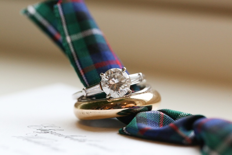 Diamond Ring %26 Gold Band on Plaid Ribbon
Photography: Robyn Rachel Photography
Read More:
http://www.insideweddings.com/weddings/christmas-theme-wedding-with-festive-red-green-decor-in-illinois/729/ Gold men's wedding band and round cut diamond engagement ring with side stones on plaid invitation