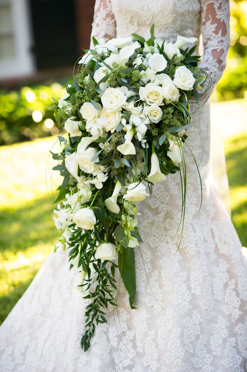 Dramatic Cascading Ivory Bouquet
Photography: Chris Bailey Photography
Read More:
http://www.insideweddings.com/weddings/southern-at-home-wedding-inspired-by-father-of-the-bride-in-texas/753/ Bride in Isabelle Armstrong wedding dress holding cascading bouquet of green leaves, white flowers