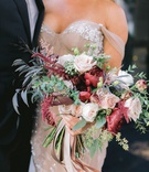 Bride with Fall Garden-Style Bouquet
Photography: Maya Myers Photography
Read More:
http://www.insideweddings.com/weddings/candlelit-jewish-ceremony-unique-cozy-outdoor-reception-in-la/1346/ bride in blush off shoulder inbal dror wedding dress foliage fall bouquet burgundy flowers