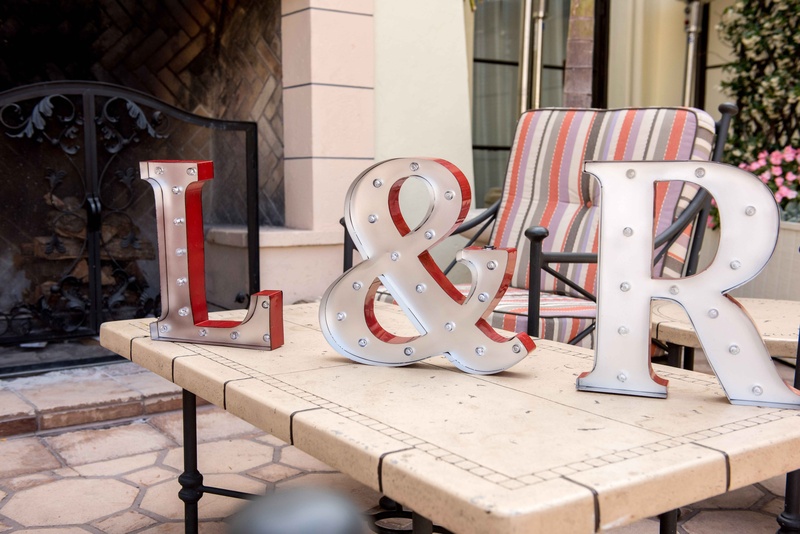 Light-Up Marquee Initials
Photography: Laurie Bailey Photography
Read More:
http://www.insideweddings.com/weddings/classic-california-wedding-with-outdoor-ceremony-indoor-reception/853/ silver and red light up marquee letters in bride and groom's initials, ampersand