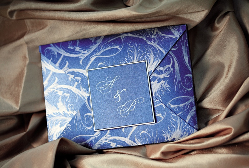 Wedding Invitation
Photography: Chris + Lynn Photographers
Read More:
http://www.insideweddings.com/weddings/butterfly-inspired-spring-wedding-in-canada/189/ Wedding invitation envelope, in blue with a white pattern, sealed with the couple's monogram