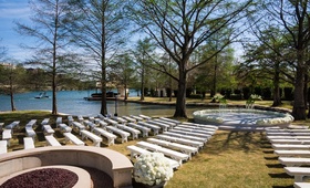 Lakeside Ceremony Seating
Photography: Robert Evans Studios
Read More:
http://www.insideweddings.com/weddings/an-austin-texas-lake-house-wedding-with-a-natural-color-palette/568/ White benches on grass arranged around podium