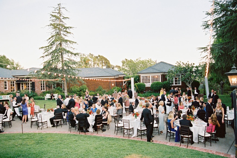 Guests Enjoying Backyard Wedding
Photography: Ryan Ray Photography
Read More:
http://www.insideweddings.com/weddings/outdoor-wedding-with-vibrant-pink-orange-decor-in-california/723/ Outdoor wedding at bride's parents' house with round tables and long farm tables