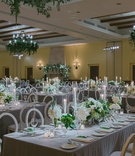Greenery Chandeliers Over Reception
Photography: Amy %26 Stuart Photography
Read More:
http://www.insideweddings.com/weddings/outdoor-jewish-ceremony-with-white-green-color-palette-in-ojai/1049/ grey linens, white and green wedding reception, greenery chandelier, taper candles