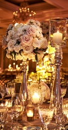 Tall Centerpiece of Pale Pink Roses
Photography: KingenSmith
Read More:
http://www.insideweddings.com/weddings/an-opulent-spring-wedding-with-timeless-elegant-decor-in-chicago/1007/ Tall centerpiece arrangement with pink rose ivory rose candlelight in tall candleholders
