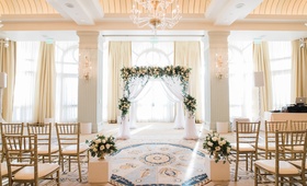 Elegant Indoor Ceremony in Santa Monica
Photography: Jillian Rose Photography
Read More:
http://www.insideweddings.com/weddings/indoor-wedding-with-beach-inspired-color-palette-in-santa-monica/1052/ indoor ceremony with arch of greenery and white flowers, white drapery
