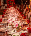 Wood Table with Low Pink Centerpieces
Photography: Suzanne Delawar Studios
Read More:
http://www.insideweddings.com/weddings/intimate-oceanfront-wedding-with-romantic-red-pink-white-palette/1235/ wedding reception long wood table pink flower centerpiece red goblets roses