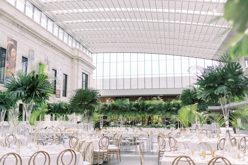 Natural Light-Filled Reception Space
Photography: Lauren Gabrielle Photography
Read More:
http://www.insideweddings.com/weddings/summer-real-wedding-featuring-tropical-decor-at-an-art-museum/1328/ wedding reception cleveland museum of art tall ceiling glass skylight tropical centerpiece monstera