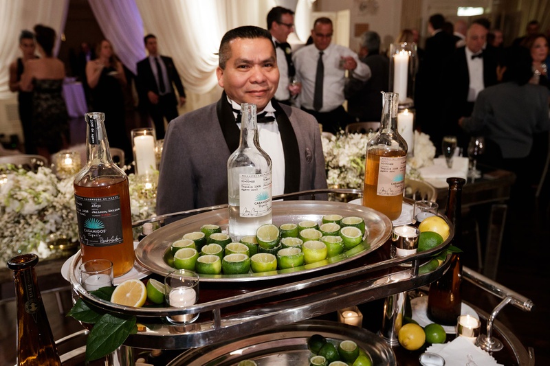 Server with Limes %26 Tequila
Photography: Bob %26 Dawn Davis Photography
Read More:
http://www.insideweddings.com/weddings/modern-glamorous-jewish-wedding-with-unique-decor-in-chicago/1154/ server with cart filled with hollowed out lime shot glasses and casamigos tequila