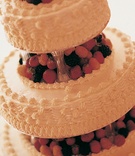 Traditional Diplomat Cake
Photography: Katherine Lasford
Read More:
http://www.insideweddings.com/weddings/victorian-theme-home-wedding-in-vancouver-british-columbia/119/ Tiered white wedding cake with fresh berries