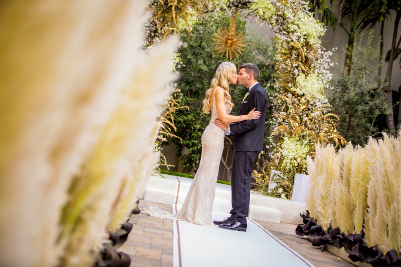 Pampas Grass-Lined Aisle
Photography: Laura Grier of Beautiful Day Photography
Read More:
http://www.insideweddings.com/weddings/glamorous-art-deco-inspired-wedding-in-downtown-los-angeles/1162/ pampas grass along aisle, art deco inspired wedding, elaborate chuppah