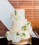 Patterned Cake with Fresh Flowers
Photography: Erin Wilson Photography
Read More:
http://www.insideweddings.com/weddings/timeless-wedding-with-white-black-and-gold-palette-in-little-rock/993/ art deco relief inspired wedding cake pattern with fresh roses and hydrangeas