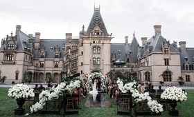 Ceremony on Biltmore Estate Lawn
Photography: Parker J Pfister Photographer
Read More:
http://www.insideweddings.com/weddings/gorgeous-alfresco-ceremony-tented-reception-at-a-luxurious-estate/1044/ Wedding ceremony with black wrought iron gates, white flowers, black aisle runner outdoors castle
