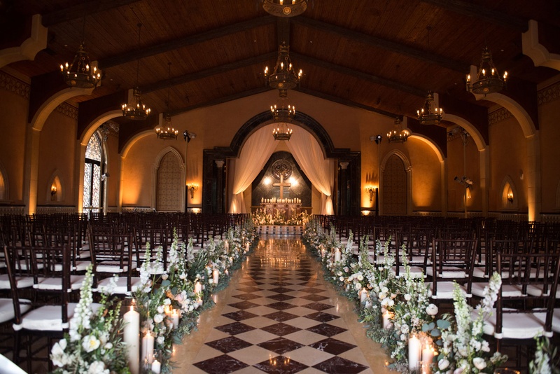 Church-Inspired Indoor Ceremony
Photography: Triple Cord Photography
Read More:
http://www.insideweddings.com/weddings/destination-wedding-with-outdoor-reception-lavish-after-party/982/ Grand del mar wedding ceremony diamond pattern tiles church feel wood chairs rustic elegant flowers