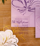 Translucent Invitation with Purple %26 Gold
Photography: Amy Anaiz Photography
Read More:
http://www.insideweddings.com/weddings/luxe-springtime-wedding-inspiration-shoot-with-delectable-desserts/1120/ Purple lettering gold flower purple envelope see through clear lucite acrylic invite on wood table