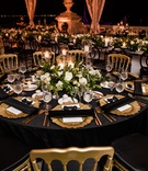 Black and Gold Reception
Photography: Manolo Doreste Photographer
Read More:
http://www.insideweddings.com/weddings/alfresco-nighttime-ceremony-and-ornate-tented-reception-in-miami/1254/ wedding reception table, gold chairs, black linens and napkins, gold charger plates, green and white