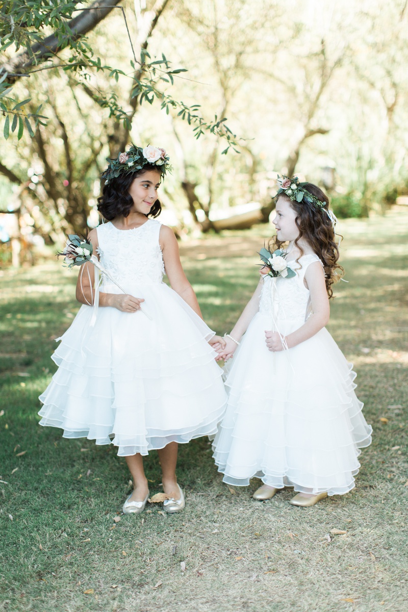 Flower Girls with Floral Crowns and Wands
Photography: Hello Blue Photo
Read More:
http://www.insideweddings.com/weddings/boho-chic-wedding-with-traditional-jewish-ceremony-in-malibu/1156/ two flower girls with white dresses, flower crowns, flower wands