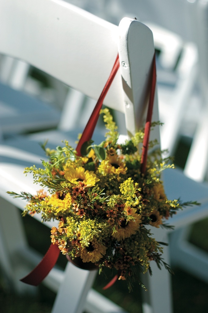 Fall Seating Decoration
Photography: Artisan Events
Read More:
http://www.insideweddings.com/weddings/refined-casual-wedding-at-a-private-residence-in-illinois/206/ Autumn flowers and foliage hanging from white ceremony chair