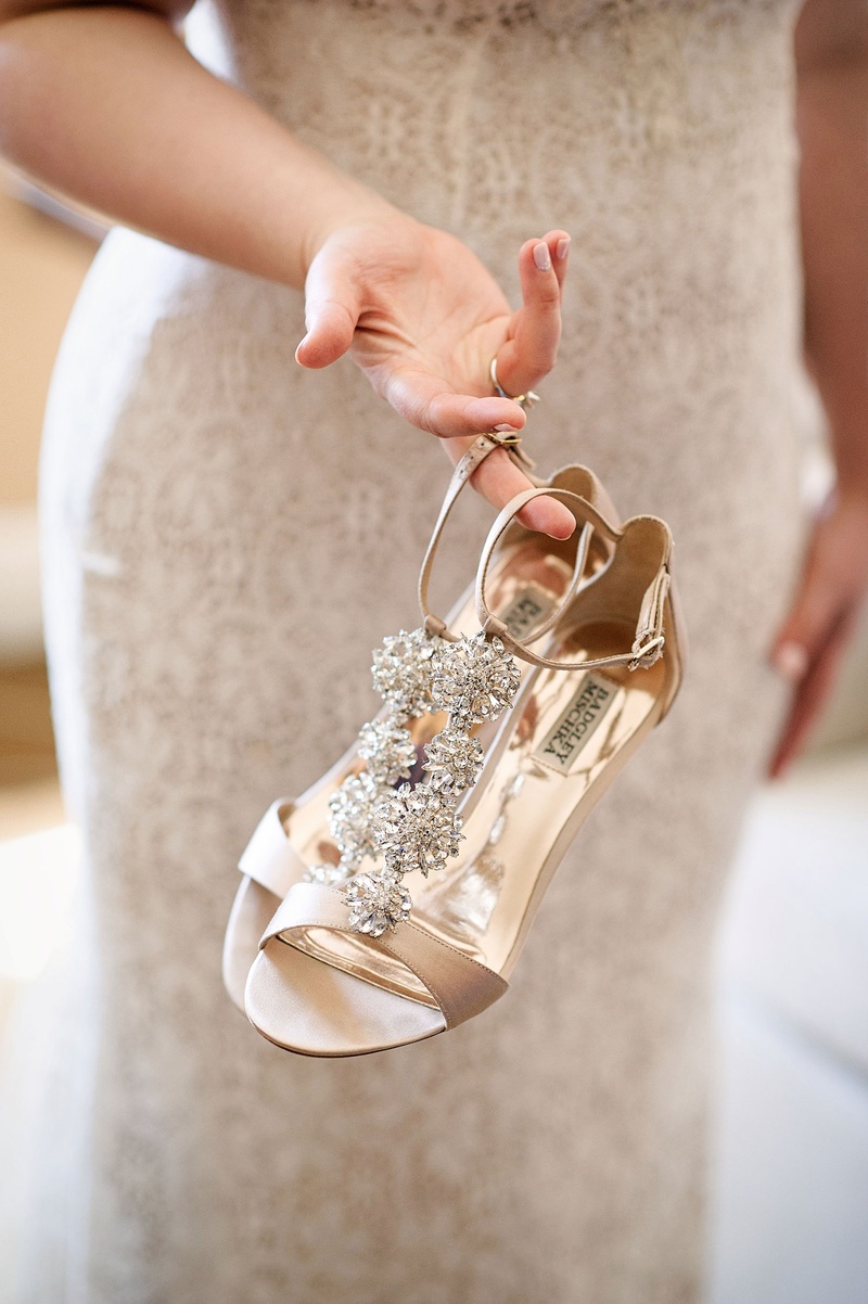 Open-Toe Nude Bridal Shoes with Crystals
Photography: Next Exit Photography
Read More:
http://www.insideweddings.com/weddings/alfresco-interfaith-ceremony-ballroom-reception-in-santa-monica/963/ Bride holding Badgley Mischka shoes with nude and crystal details ankle strap open toe