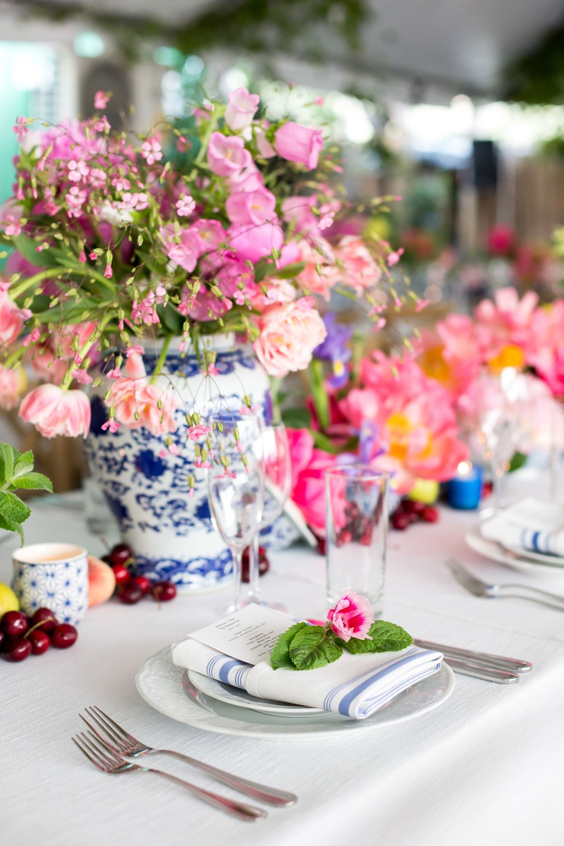 Striped Napkin with Pink Blossom
Photography: Maya Myers Photography
Read More:
http://www.insideweddings.com/weddings/colorful-tented-rehearsal-dinner-with-garden-elements-in-brooklyn/1188/ chinoiserie vases, pink flowers, blue and silver striped napkins topped with pink flower and leaves