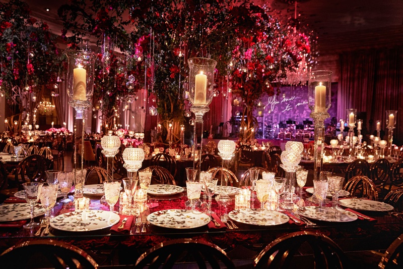 Opulent %26 Dramatic Reception Décor
Photography: KingenSmith
Read More:
http://www.insideweddings.com/weddings/luxurious-wedding-featuring-sentimental-butterfly-decor-in-chicago/1348/ opulent wedding reception ballroom purple neon sign red lighting decor butterfly china candles