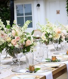 Rose and Peony Centerpieces on Long Table
Photography: Tine Hoffman
Read More:
http://www.insideweddings.com/weddings/intimate-california-wedding-with-natural-elements-and-modern-trends/761/ White fluffy peonies, pink blushing bride, garden roses, sweet pea, white spirea, pieris