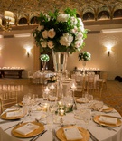 Full Centerpiece on Tall, Wide Vase
Photography: Carrie Rodman Photography
Read More:
http://www.insideweddings.com/weddings/intimate-destination-wedding-with-classic-decor-in-palm-beach/1302/ centerpiece with greenery, soft blush roses, hydrangeas, wide, tall vase, gold chargers