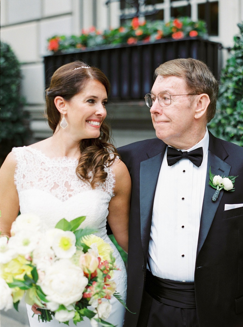 Bride Smiles Toward Father of Bride
Photography: Branco Prata
Read More:
http://www.insideweddings.com/weddings/chic-destination-wedding-with-california-style-in-washington-dc/1042/ Bride in white lace wedding dress and bouquet smiles at father of bride in tuxedo with bow tie