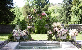 Custom Garden-Inspired Arch at Ohio Venue
Photography: Michael Bambino %26 Co.
Read More:
http://www.insideweddings.com/weddings/whimsical-open-air-secret-garden-wedding-with-soft-spring-hues/777/ a custom secret garden inspired arch with dripping greenery and pink and purple flowers