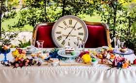 Large Clock Placed on Velvet Couch
Photography: Visuals by Arpit
Read More:
http://www.insideweddings.com/weddings/a-styled-shoot-with-vibrant-florals-inspired-by-alice-in-wonderland/903/ alice in wonderland inspired wedding styled shoot, clock on velvet couch, sweetheart table