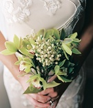 Green Orchid Bouquet
Photography: Suzanne Karp Photography
Read More:
http://www.insideweddings.com/weddings/seaside-wedding-in-california-with-beach-themed-decor/45/ Bride in beaded gown holds green flower bouquet