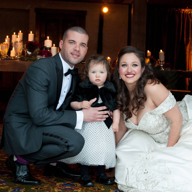 The Couple's Daughter
Photography: Handeland Tesoro Photography
Read More:
http://www.insideweddings.com/weddings/snowy-outdoor-winter-ceremony-cozy-lodge-reception/522/ Bride and groom with young daughter in polka dots
