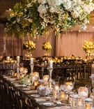 Lush Decor for Rustic Reception
Photography: Vue Photography
Read More:
http://www.insideweddings.com/weddings/romantic-rustic-chic-wedding-at-a-whiskey-distillery-in-atlanta/942/ floral chandelier with tall and short candles wedding reception decor