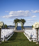 Outdoor Ceremony Set-Up, Overlooking Ocean
Photography: Joe Laurin Photography
Read More:
http://www.insideweddings.com/weddings/simple-chic-seaside-wedding-with-white-palette-in-rhode-island/953/ outdoor ceremony set up overlooking atlantic ocean lawn chairs tall vases floral arch