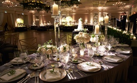 Candlelit Reception Ballroom in Chicago
Photography: KingenSmith
Read More:
http://www.insideweddings.com/weddings/opulent-wedding-with-organic-textures-elegant-decor-in-chicago/1010/ Floral and foliage chandeliers with candles and tall candlesticks ivory flowers on tables live band