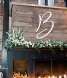 Initial and Candles
Photography: Kaylie Plummer Photography
Read More:
http://www.insideweddings.com/weddings/chic-alfresco-hotel-wedding-with-elements-of-modern-greenery/1350/ large cutout monogram on wood, florals, candles