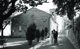 Bride and Groom in Tuscany
Photography: The Day by Ira Lippke
Read More:
http://www.insideweddings.com/weddings/romantic-ceremony-on-bluff-tented-reception-in-tuscany/1311/ black and white photo of a bride and groom walking through tuscany