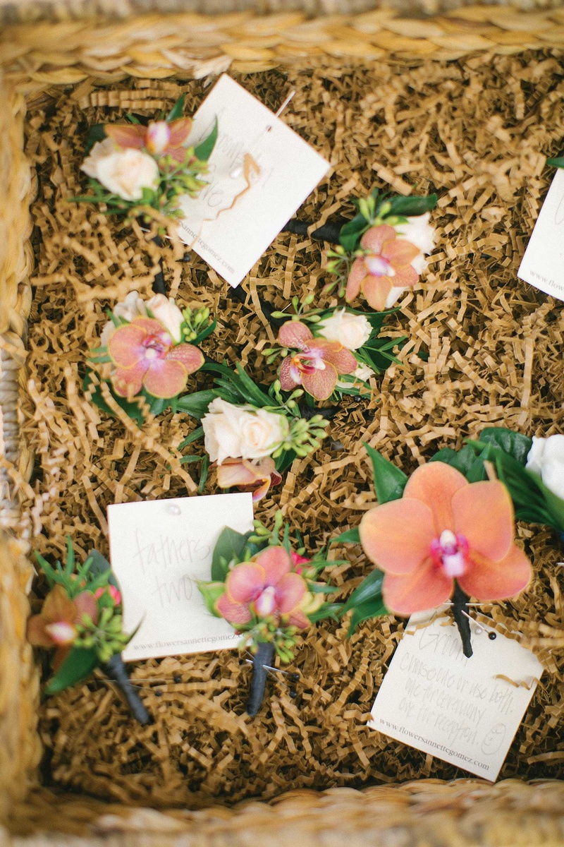Tropical Boutonnieres in Basket
Photography: Bryan Miller Photography
Read More:
http://www.insideweddings.com/weddings/church-ceremony-tropical-outdoor-reception-in-san-diego/1192/ orchid pink boutonniere for groom fathers groomsmen in basket