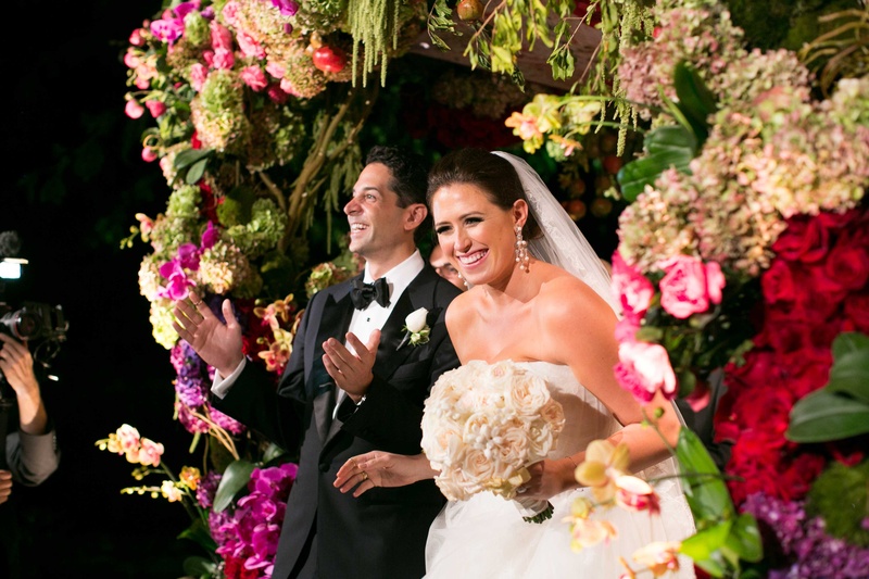 Bride %26 Groom Under Vibrant Floral Chuppah
Photography: Mi Belle Photographers
Read More:
http://www.insideweddings.com/weddings/colorful-outdoor-wedding-with-supper-club-theme-in-los-angeles-ca/741/ Bride in Vera Wang wedding dress holding round ivory bouquet under flower embellished chuppah