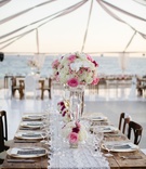 Tented Beach Wedding with Wood Tables
Photography: Sara Richardson Photography
Read More:
http://www.insideweddings.com/weddings/wags-barbie-blank-hockey-player-sheldon-sourays-mexico-wedding/964/ Wood table lace runner wedding reception Barbie Blank Sheldon Souray high and low white pink flowers