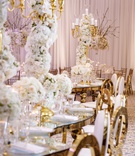 Tall Candelabra on Serpentine Table
Photography: Amy Anaiz Photography
Read More:
http://www.insideweddings.com/weddings/luxe-wedding-of-nfl-player-tahir-whitehead-at-elegant-castle-venue/1267/ wedding reception s shape serpentine table tall centerpiece white flowers gold candelabra chairs