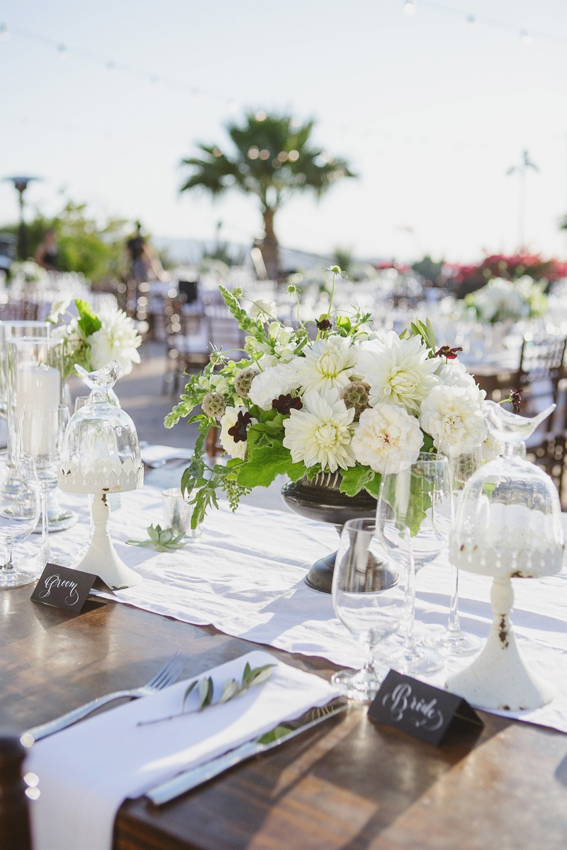 Alfresco Rustic Reception
Photography: Jasmine Star Photography
Read More:
http://www.insideweddings.com/weddings/spanish-style-ceremony-outdoor-ranch-wedding-reception/504/ Chalkboard inspired escort cards on wood table with white runner