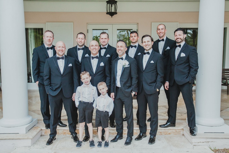 Groom, Groomsmen, and Ring Bearers
Photography: LuvRox Photography
Read More:
http://www.insideweddings.com/weddings/luxurious-destination-wedding-at-the-ocean-club-in-the-bahamas/1324/ groom and groomsmen in black suits with ring bearers in shorts