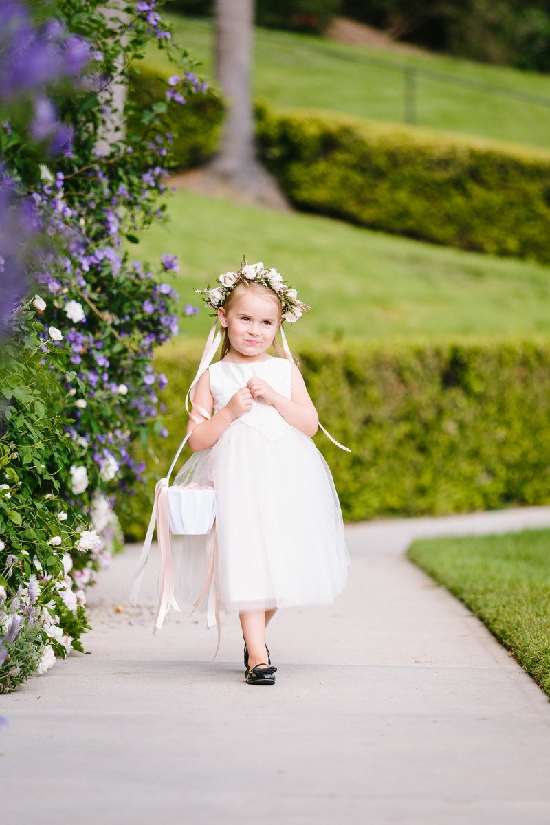 Flower Girl Walking to Ceremony
Photography: Jodee Debes Photography
Read More:
http://www.insideweddings.com/weddings/elegant-alfresco-ceremony-reception-with-parisian-elements/1176/ adorable flower girl with flower crown, basket in crook of arm, black shoes