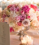 Mercury-Glass Centerpiece
Photography: Brett Matthews Photography
Read More:
http://www.insideweddings.com/weddings/regal-outdoor-ceremony-ballroom-reception-at-oheka-castle-in-ny/821/ White, pink rose wedding reception centerpiece in mercury glass vase on table