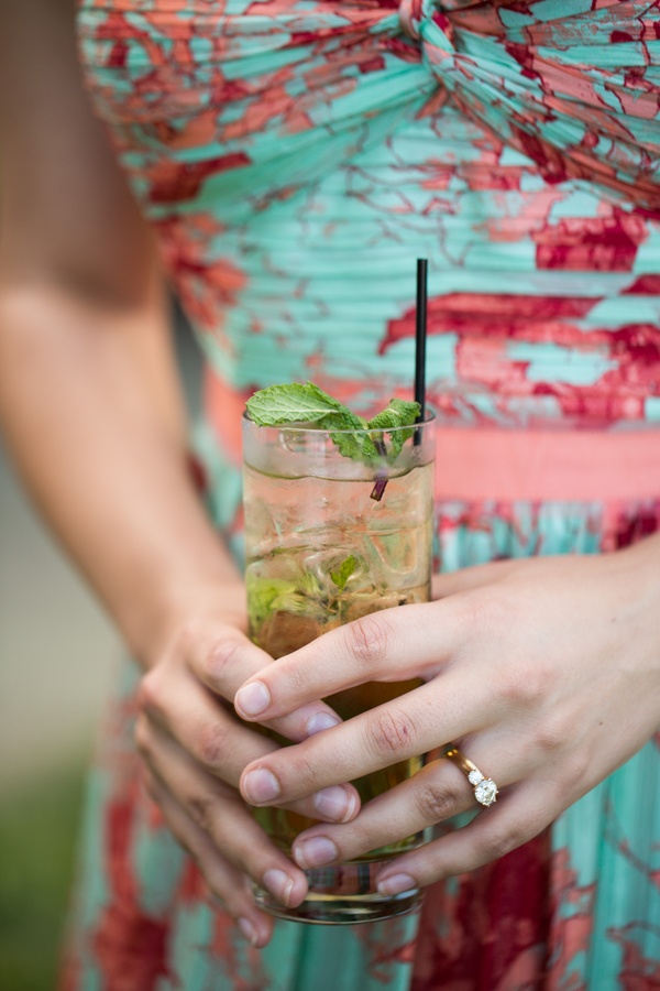Mint Julep
Photography: Aaron Watson Photography
Read More:
http://www.insideweddings.com/weddings/classic-virginia-wedding-inspired-by-grace-kellys-elegance/511/ Wedding guest in summer dress holding mojito