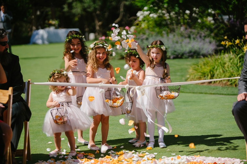 Flower Girls at Edge of Aisle
Photography: Karlisch Photography
Read More:
http://www.insideweddings.com/weddings/modern-rustic-wedding-full-of-flowers-and-geometric-details/906/ flower girls in blush dresses and greenery flower crowns throw petals outside aisle