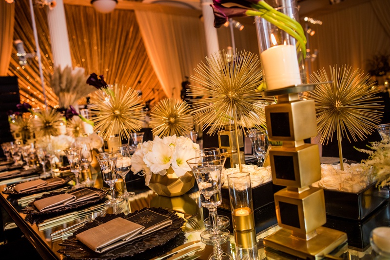Gold-and-Black Reception Décor
Photography: Laura Grier of Beautiful Day Photography
Read More:
http://www.insideweddings.com/weddings/glamorous-art-deco-inspired-wedding-in-downtown-los-angeles/1162/ art deco inspired reception, unique black and gold decor,